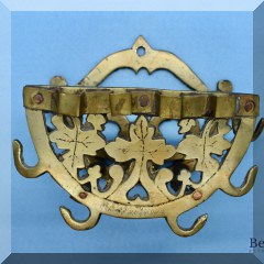 D76. Brass hanging hooks.